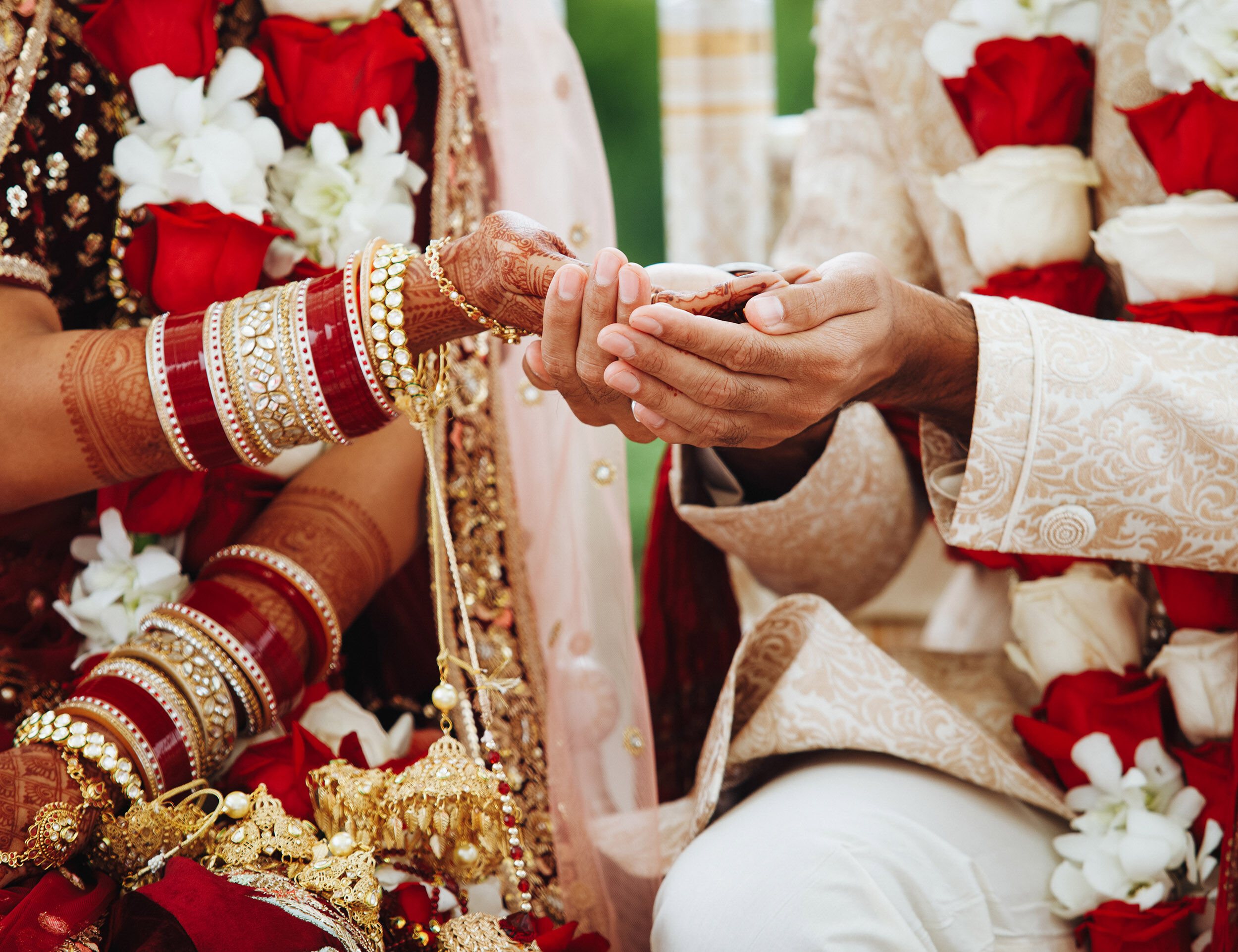 bride and grrom holding hands